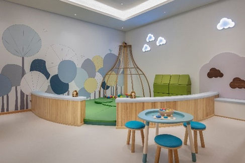 Kids' play area: putting green, toys, and seating