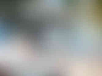 Father and child paddleboarding at a resort