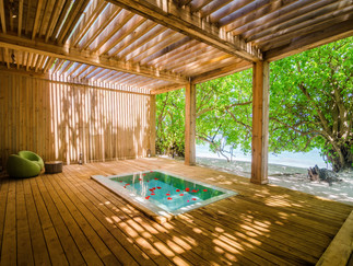 Tranquil outdoor spa with wooden pergola