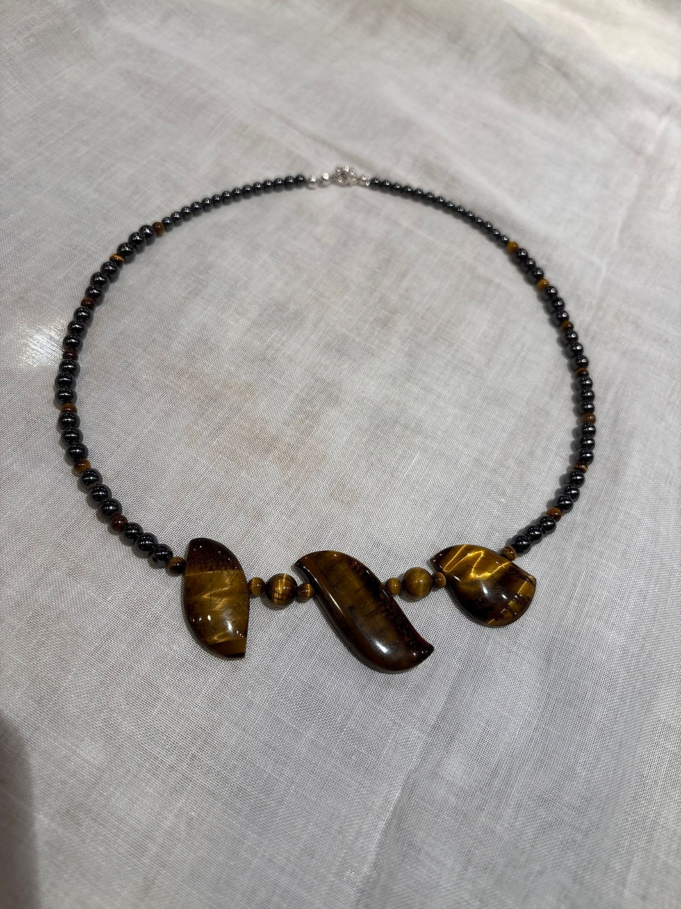 Thumbnail: Tiger eye with hematite necklaces set with sterling silver  . About 18”.  47cm