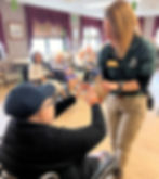 Photo of Resident petting a Hedgehog at an activity