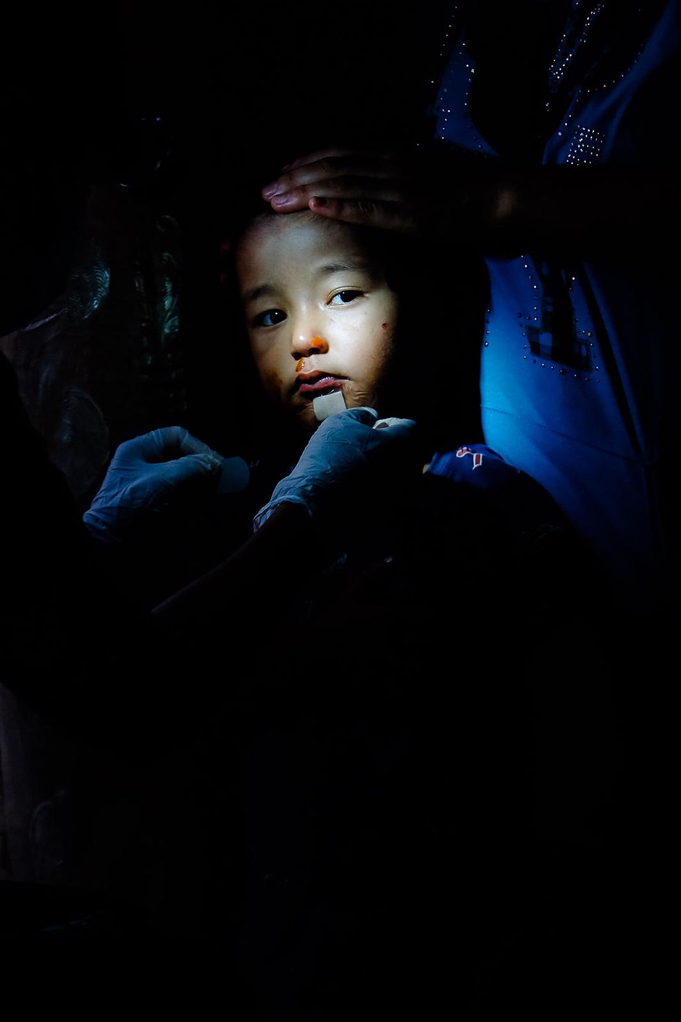 Children face at iluminated in mothers arms