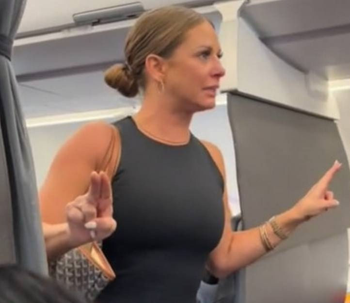 A woman on an airplane calling reality in to question