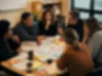 Diverse Illinois school leaders in collaborative meeting, representing thought leadership in public education.