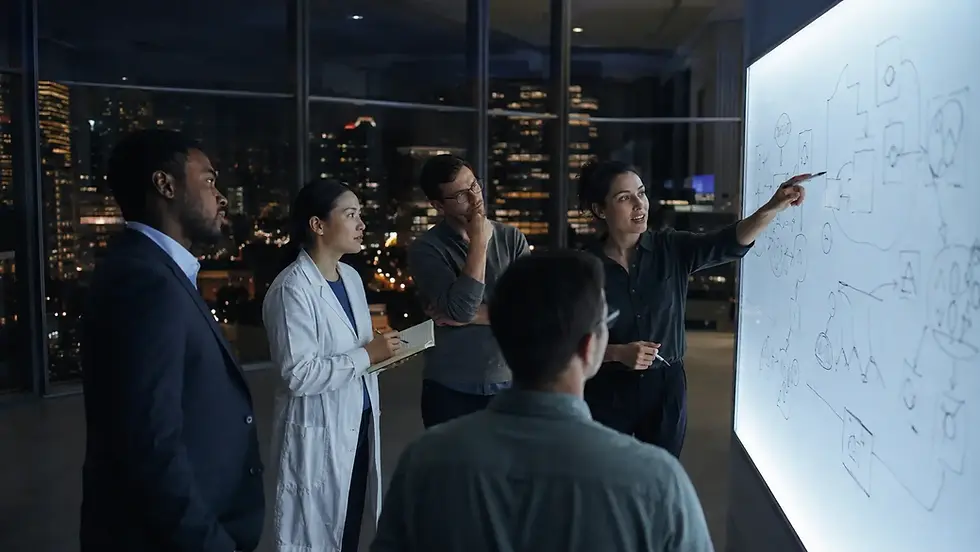 Diverse team collaborating at illuminated whiteboard at night with city skyline, representing corporate innovation and venture building