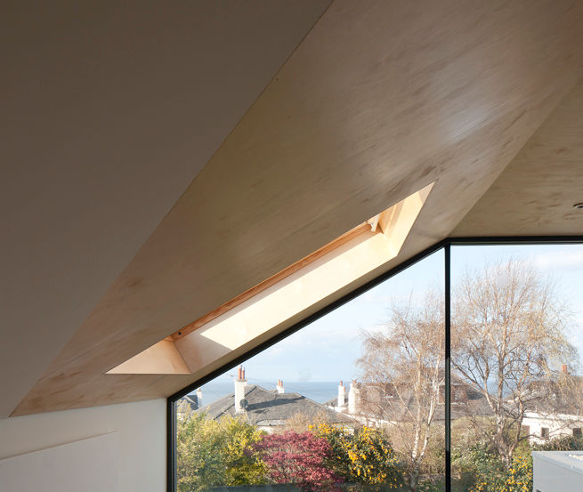Attic space with full height glass wall with seaview