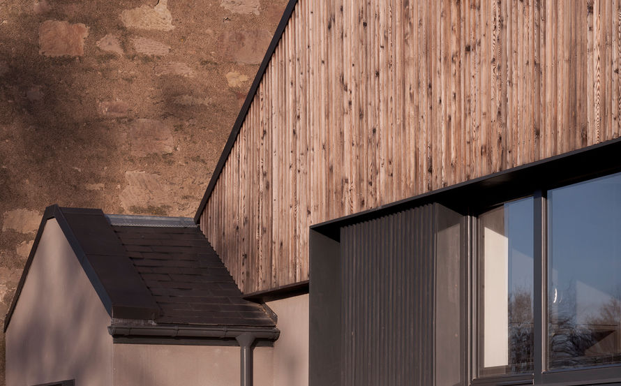 Contemporary church hall conversion clad in scorched timber