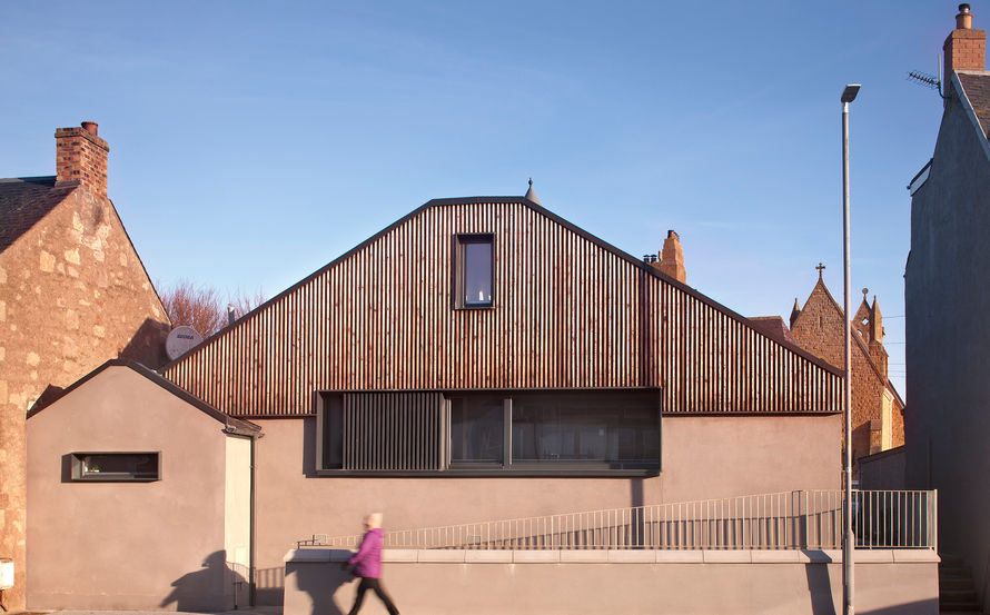 Contemporary church hall conversion clad in scorched timber