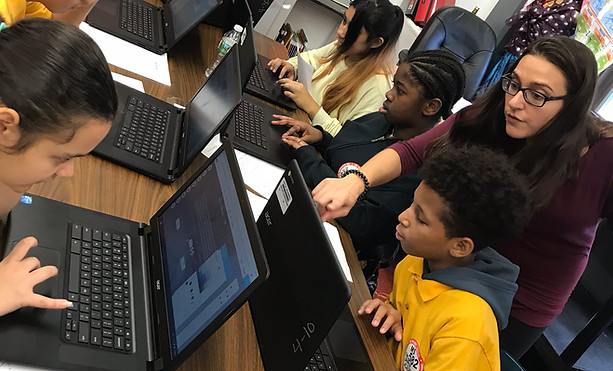 Students designing their own websites using wix