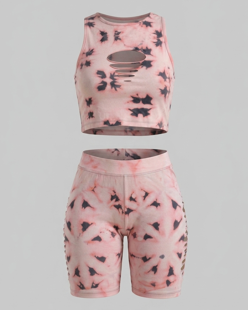 On-demand Adire Oniko short set featuring a slashed crop top and high-waisted shorts with custom reverse-dye patterns.