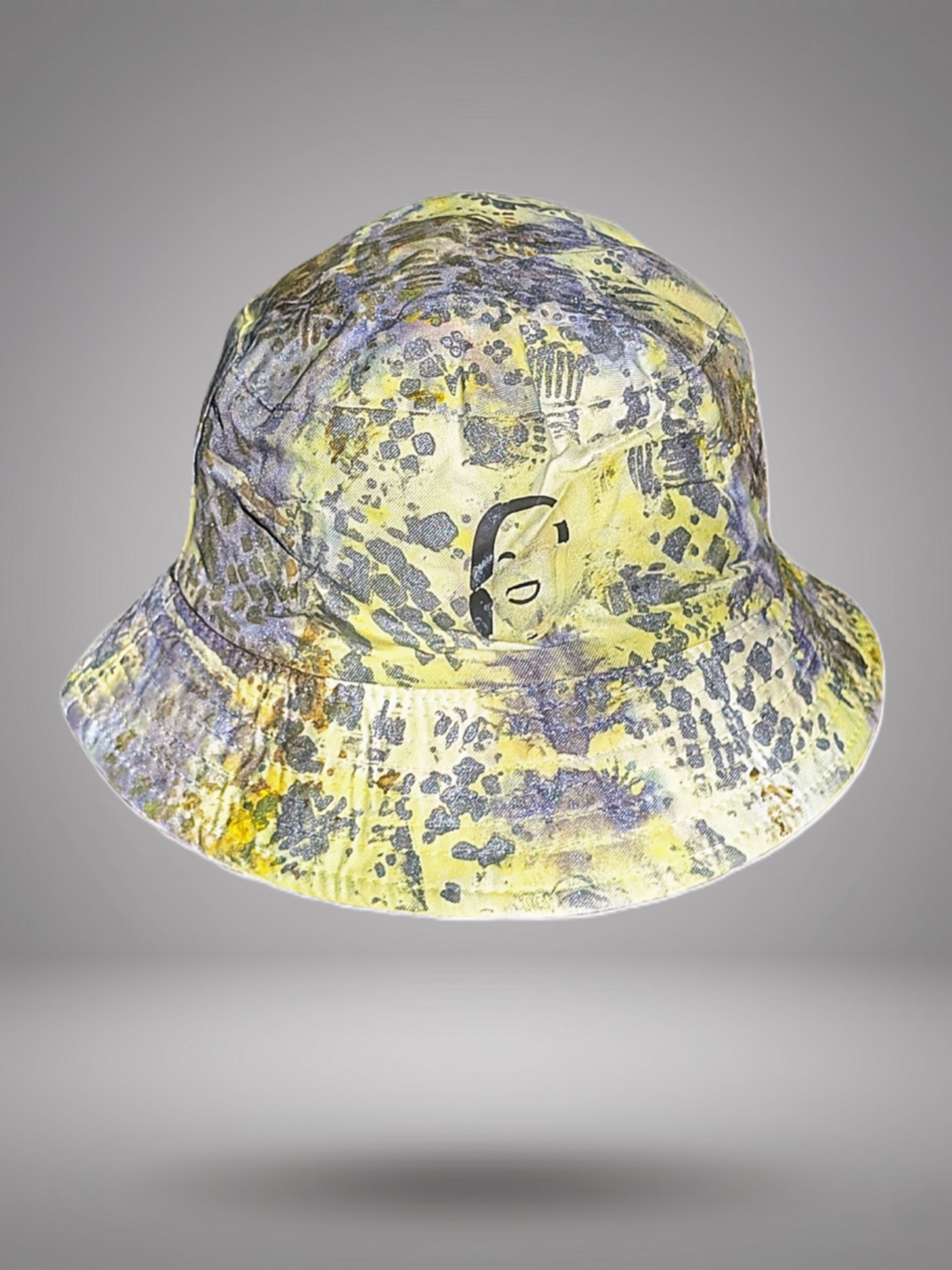 NYIANSU The Heritage hand-painted bucket hat with yellow and silver abstract patterns.