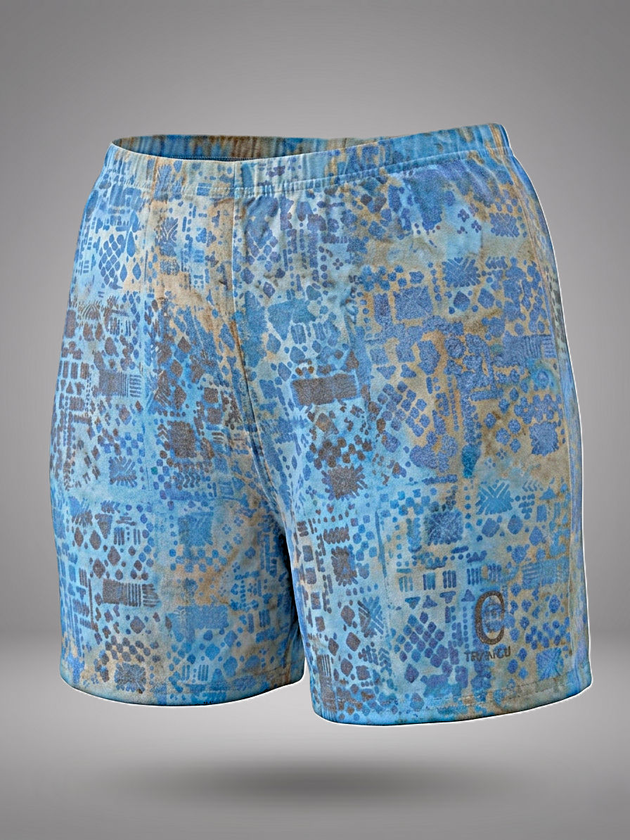 Aura Blue Ritual Shorts by Nyiansu, highcycled thanks to Adire technique and Bogolan inspired metallic symbols.