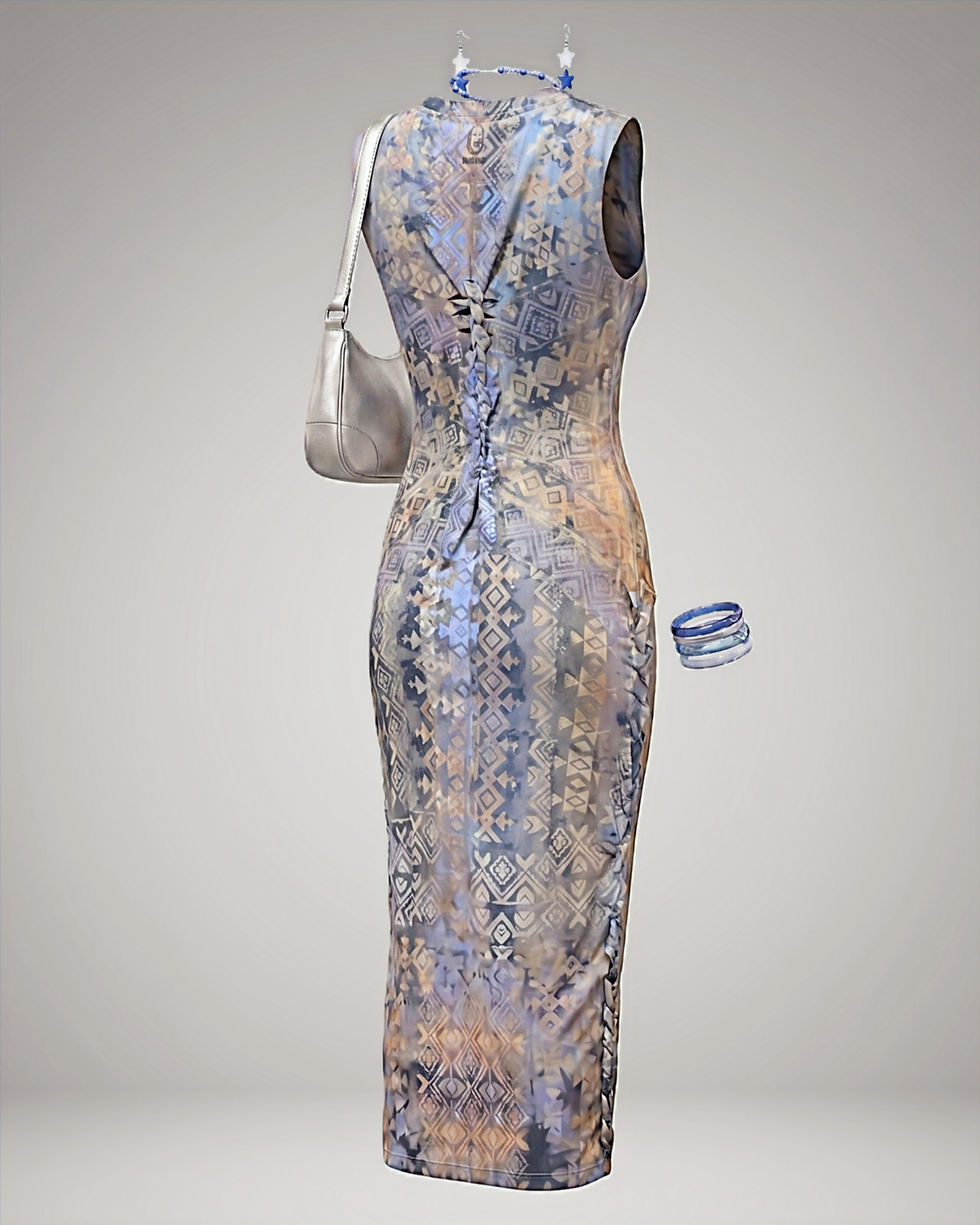 Thumbnail: Handcrafted midi bodycon dress by Nyiansu, featuring blue and earthy bogolan-inspired symbols and hand-braided details.