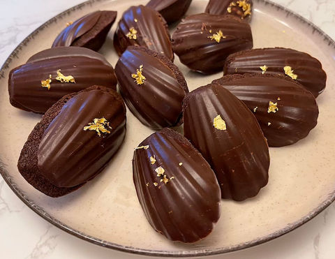 Chocolate Madeleines on a stoneware plate
