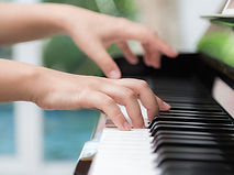 side-view-woman-s-hands-playing-piano.jpg