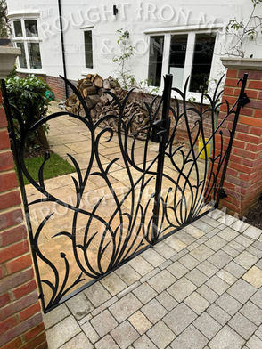 Tulip design, pedestrian garden gate. 
metal gate.