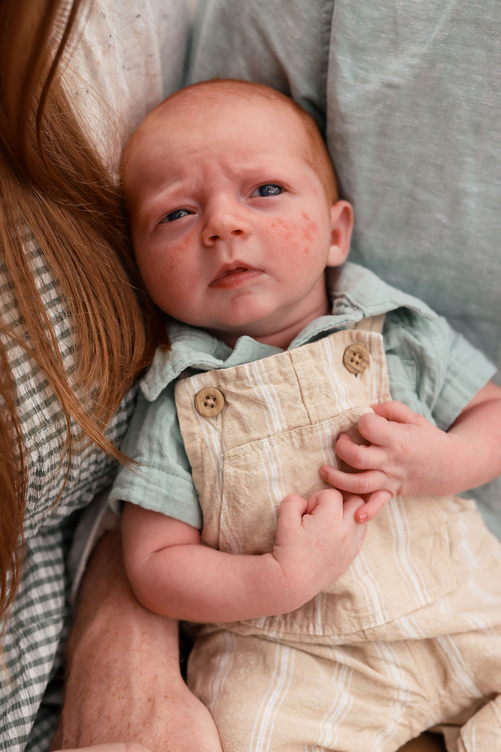 tiny newborn baby in a basket