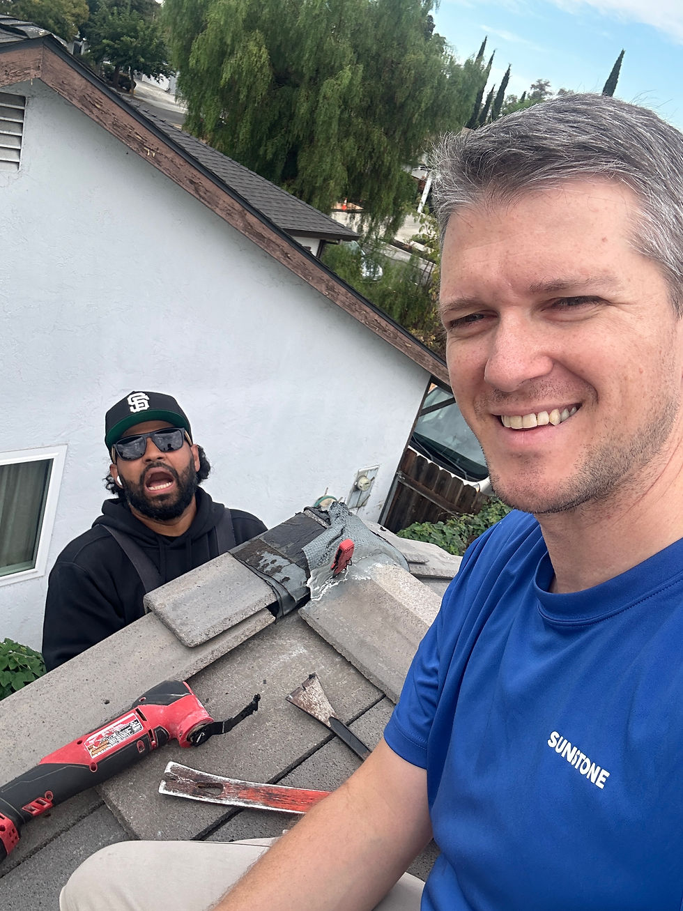 Two workers doing emergency roof repair