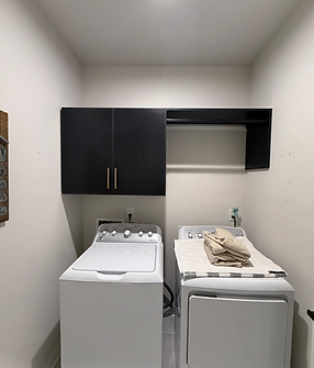 Mudroom Storage With Built-In Bench, Cabinets, And Woven Baskets