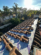Roof Repair with Tiles Temporarily Placed on Underlayment