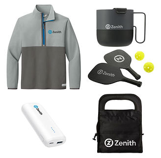 A set of branded merchandise with the "Zenith" logo, including a gray quarter-zip pullover, a black mug, two pickleball paddles with yellow balls, a white power bank, and a black cooler bag.