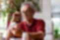 Man readying a lable on a pill bottle
