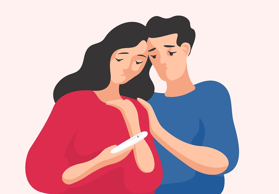 couple sad looking at pregnancy test