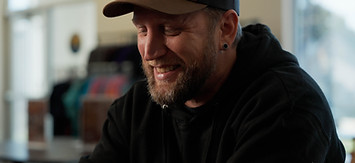 Man smiling after getting help from peer support specialist at Solutions.jpg