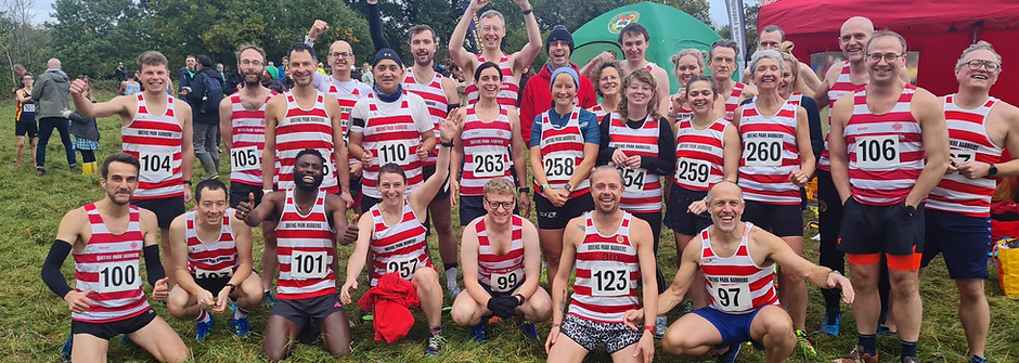 Team photo of the Liddiard 2023 Queen's Park Harriers atheletes prior to the race, looking excited.