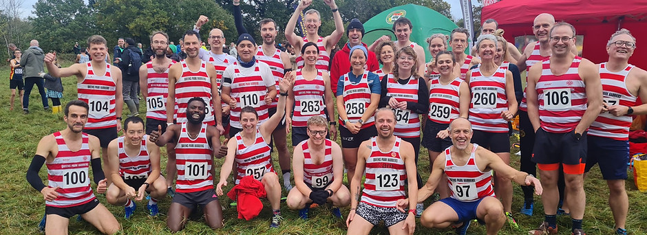 Team photo of the Liddiard 2023 Queen's Park Harriers atheletes prior to the race, looking excited.