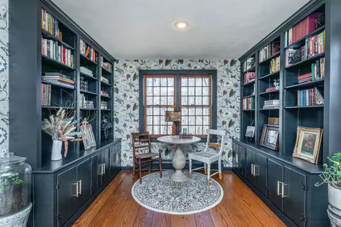 Library transformed with raven black paint and found books and objects