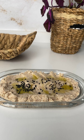 Drizzling black sesame on cheesy hazelnut curd