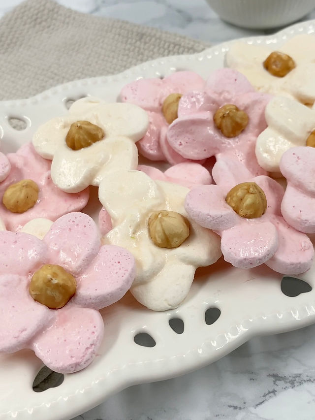 Flower shaped meringue from marshmellows on a plate