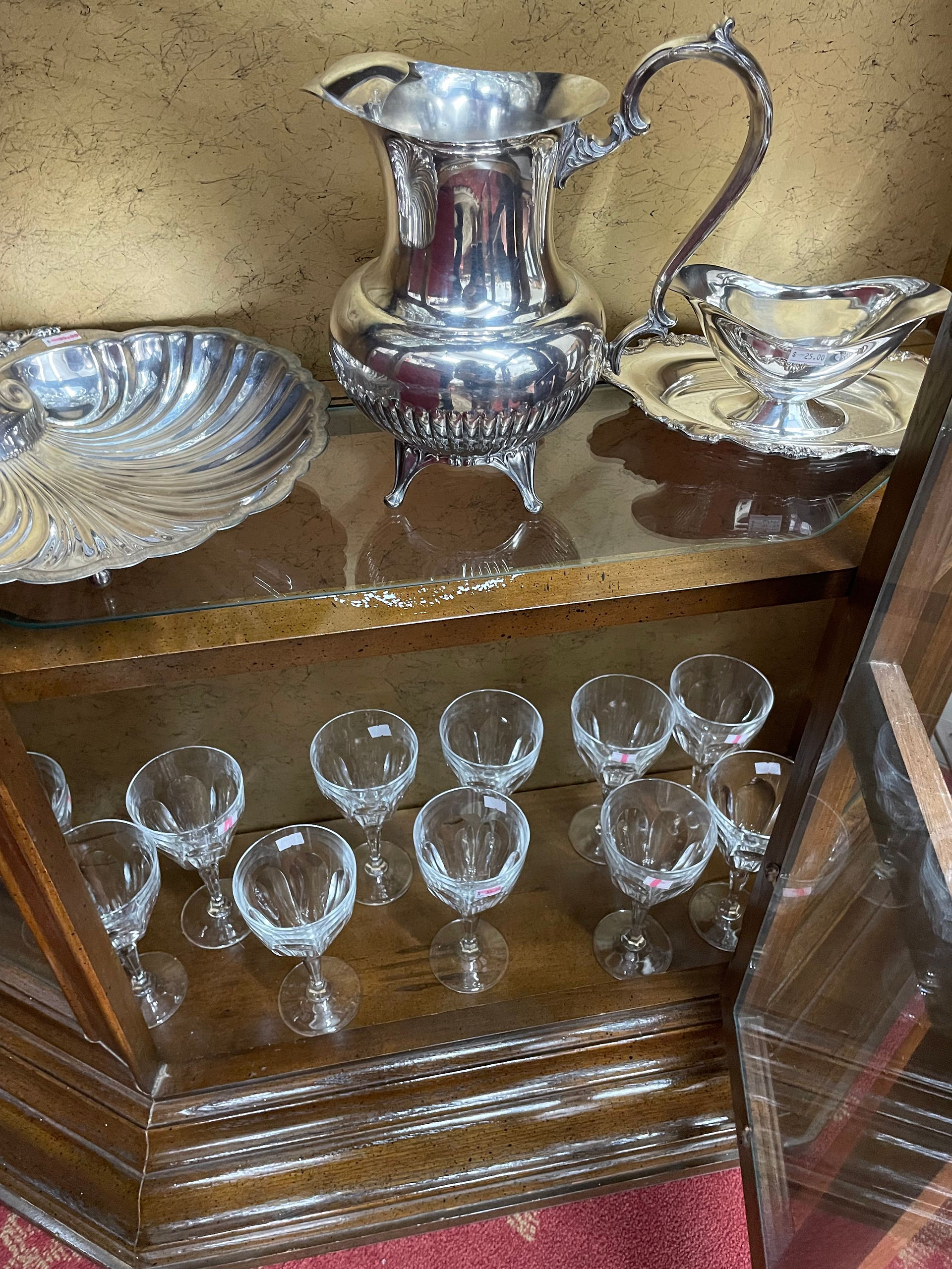 Edmond OK Estate Sale - silver tea service with crystal glasses in antique display cabinet