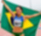 Imagem decorativa da seção de Rendimento mostrando uma atleta envolta em uma bandeira do Brasil em uma pista de atletismo.