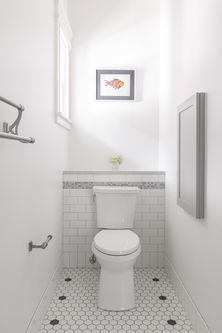 Primary washcloset toilet room with Fold Down Crossword Table