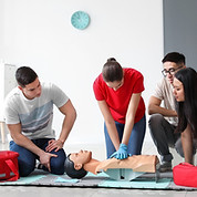 Instructor demonstrating CPR on mannequin at first aid training course_edited.jpg