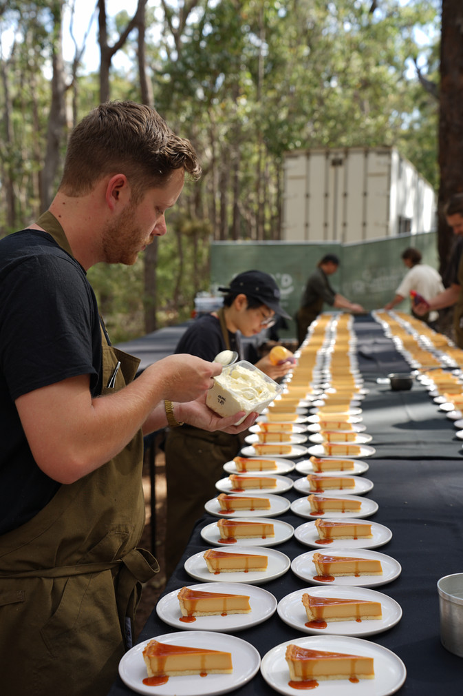Chefs Paul Iskov and Jess Court plating dishes inspired by the Noongar Emu Plum story at Nature’s Table 2025