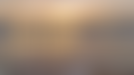 Ocean waves wash onto the shore under a glowing sunset sky, representing the flow of natural rhythms and inner balance. Megan Haggett created this image.