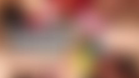 A circle of diverse women lying down with their heads together, adorned with colorful flower crowns, symbolizing unity, healing, and empowerment. Megan Haggett created this image.