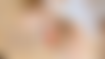 A person sitting cross-legged with a bowl of yogurt topped with granola and strawberries, symbolizing nourishment and honoring the body. Megan Haggett created this image.