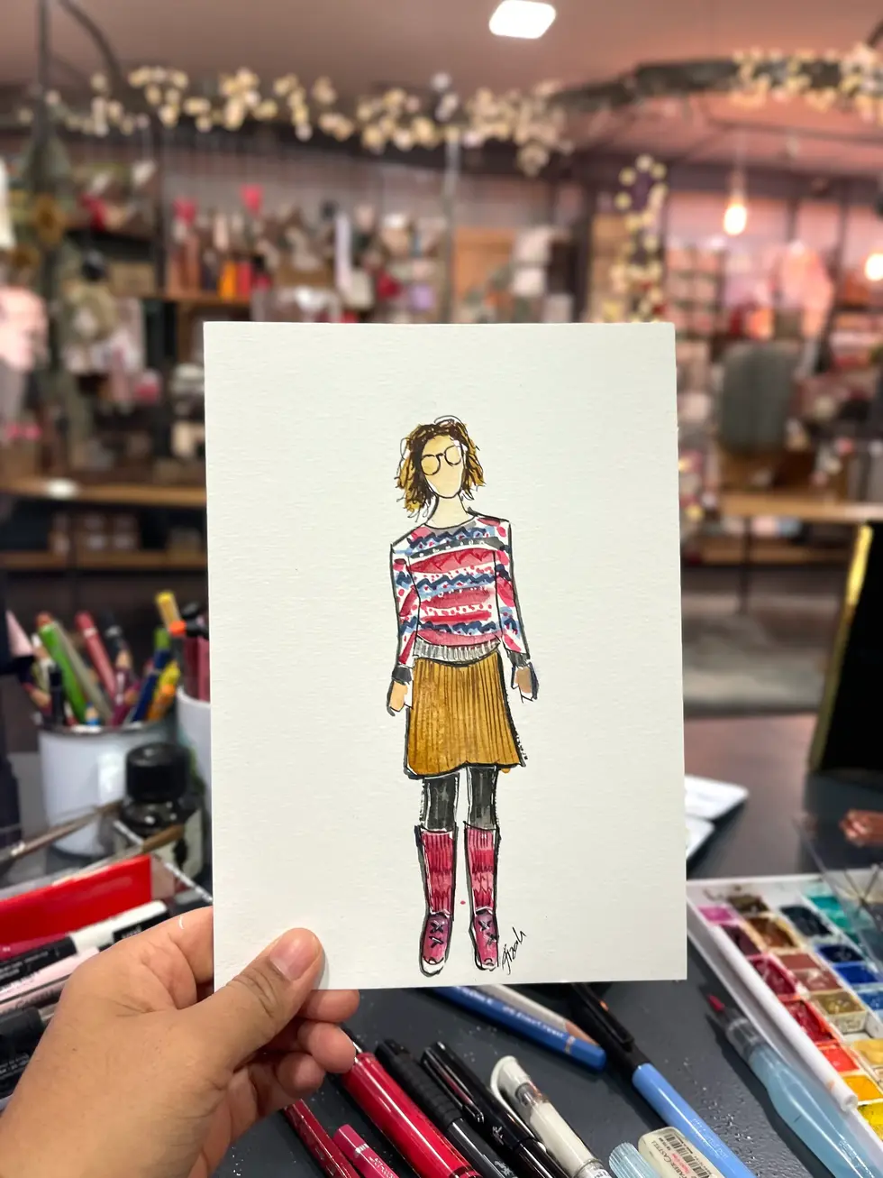 Live sketch created by artist Hafizah during an Erlangen event, capturing a moment as a unique hand-drawn keepsake.