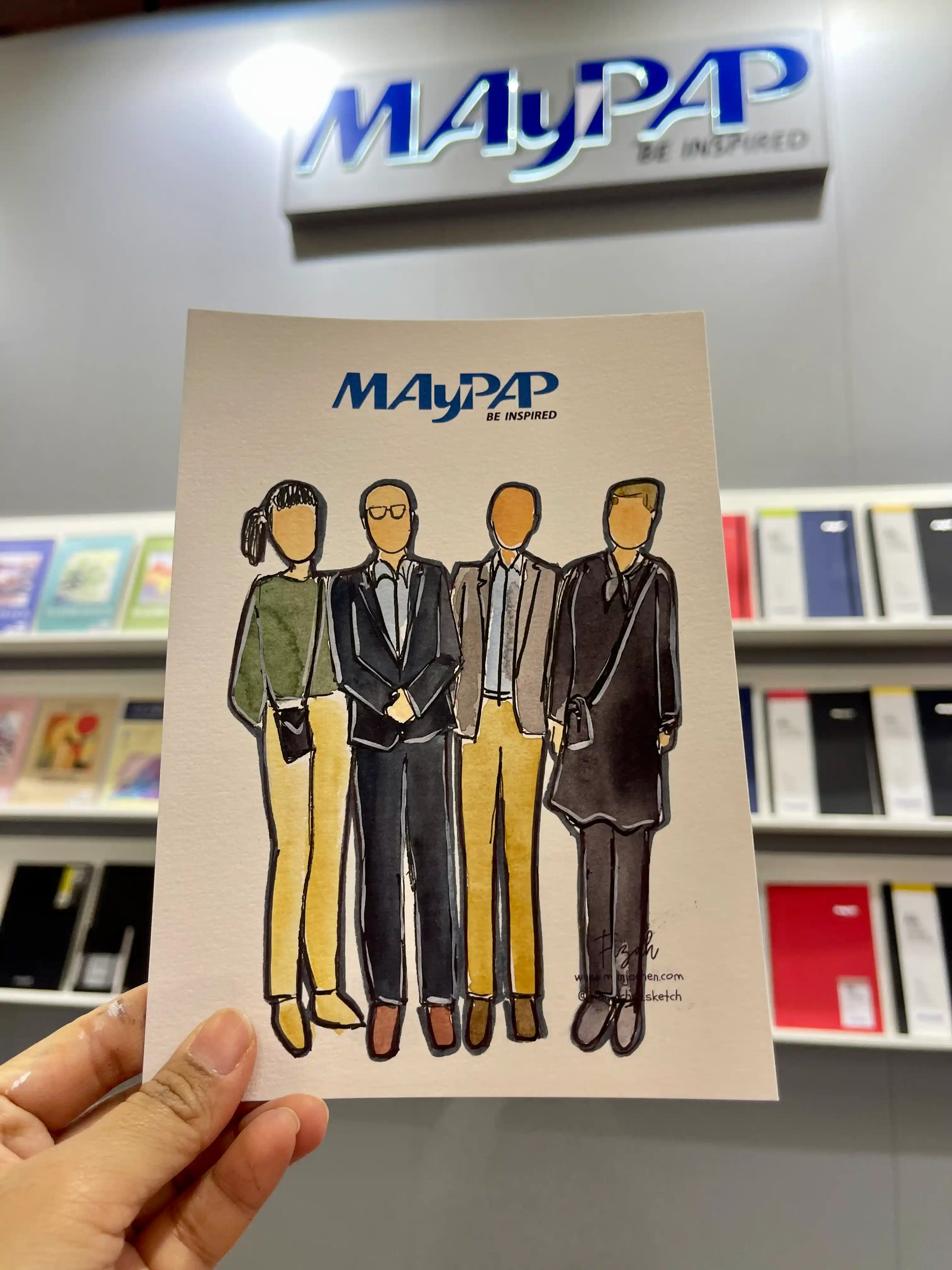 Personalized live sketches on display at the MayPap booth, offering guests a unique corporate event souvenir.