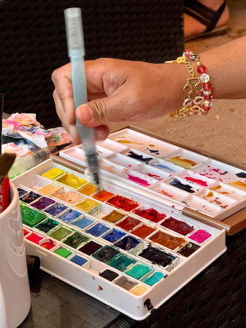 Watercolor and ink art supplies used by a live sketching artist during a corporate event in Bavaria.