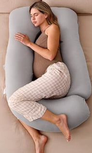 Third trimester pregnancy essentials including pregnancy pillow, sleep mask, collagen peptides, belly care products, and pregnancy support band.