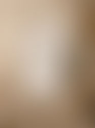 A letter titled “Woman in Survival Mode” beside a candle in soft morning light