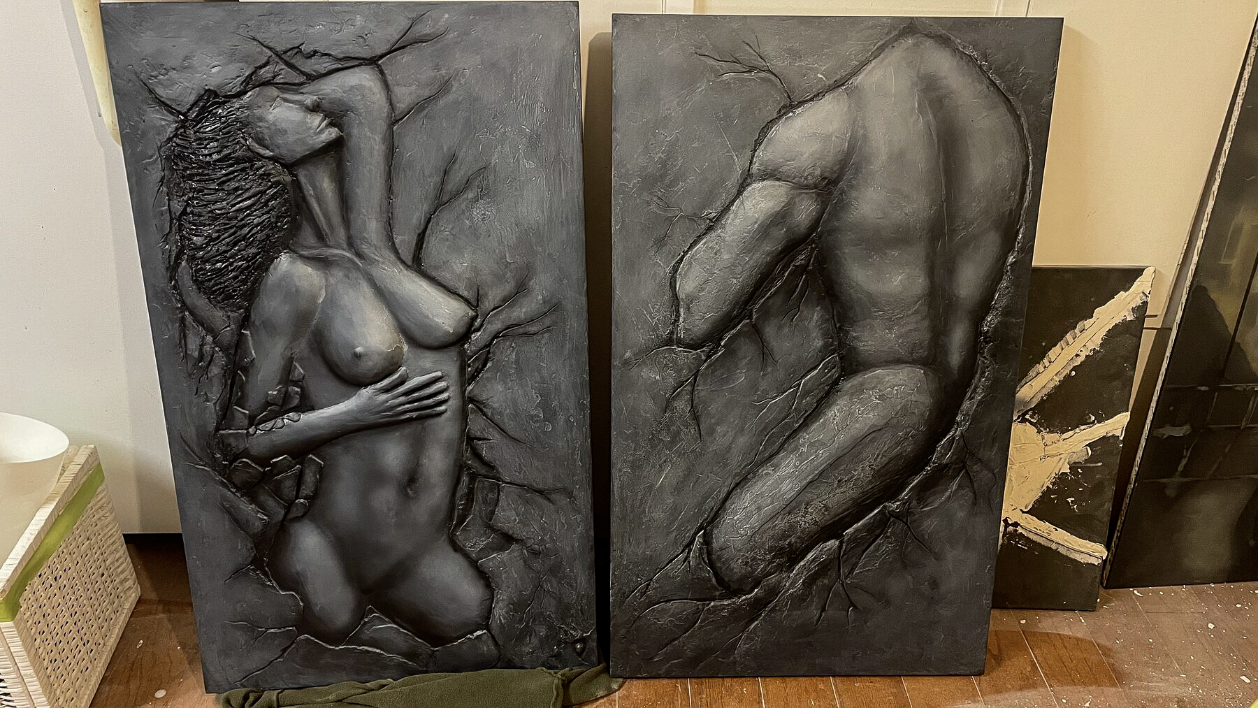 Sacrum feminine and masculine bas-relief panels displayed together
