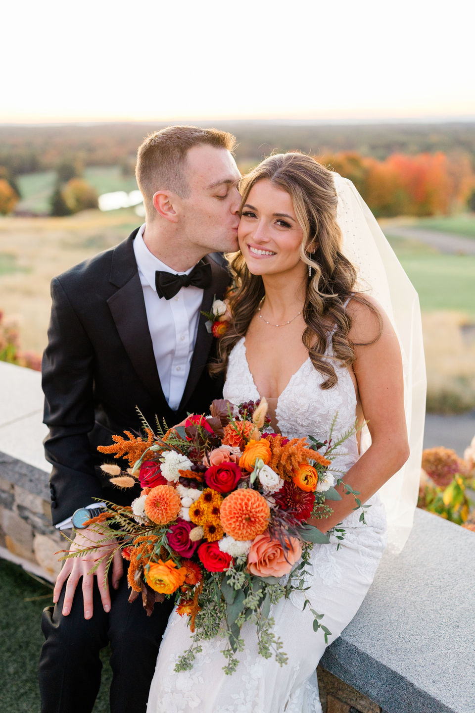 Full glam makeup and half up hair style for a bride with her groom at Starting Gate in Hampden, M