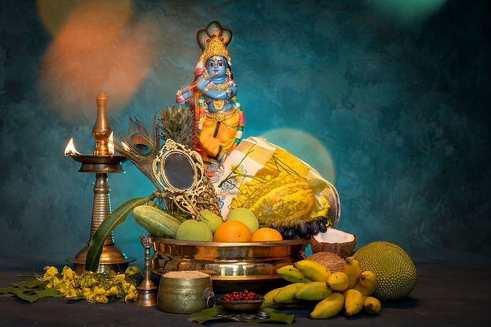 Colorful Krishna statue with fruits and a brass lamp on a table against a teal background, creating a festive and vibrant scene.
