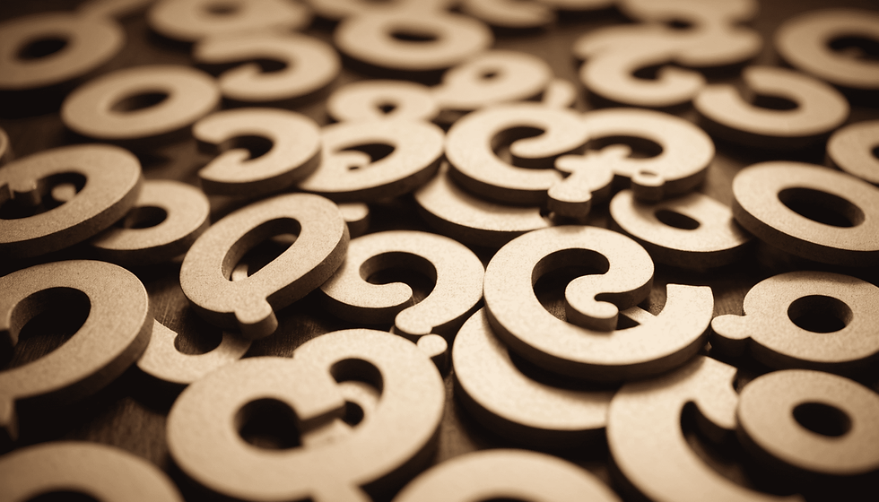 Close-up view of a stack of question marks